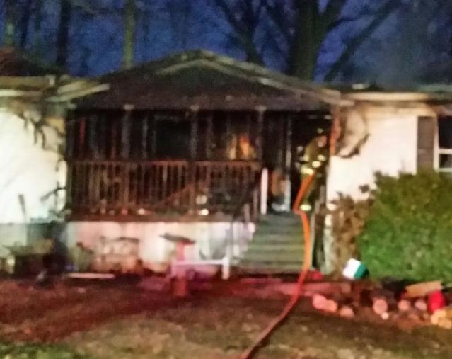 HOME HEAVILY DAMAGED IN FIRE